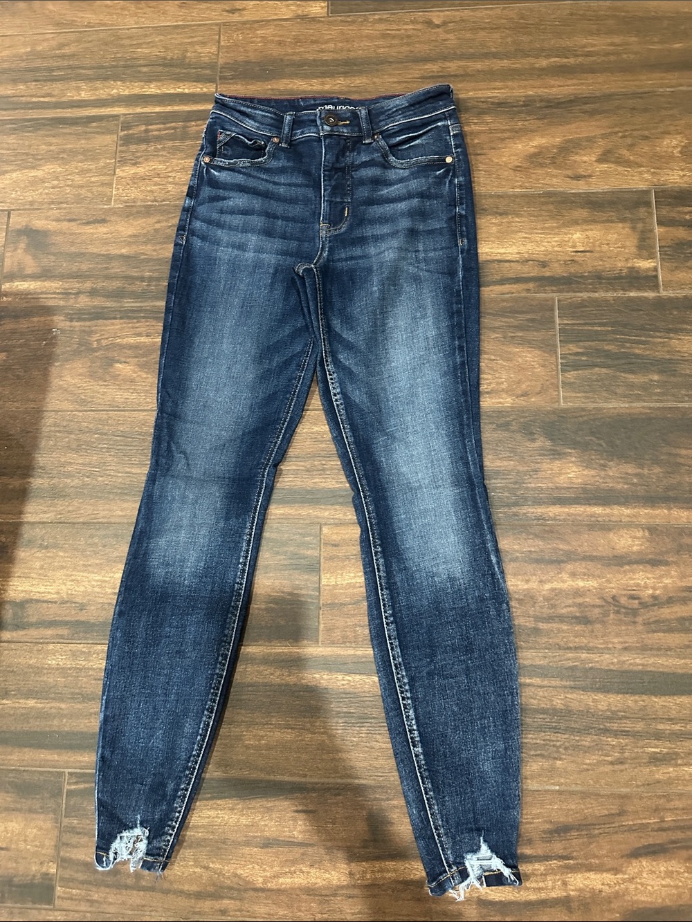 Maurices Dark Blue Skinny Jeans with Distressed Hem